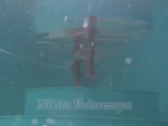 Redhead baby Nikita Vodorezova gets naked fast underwater Thumb